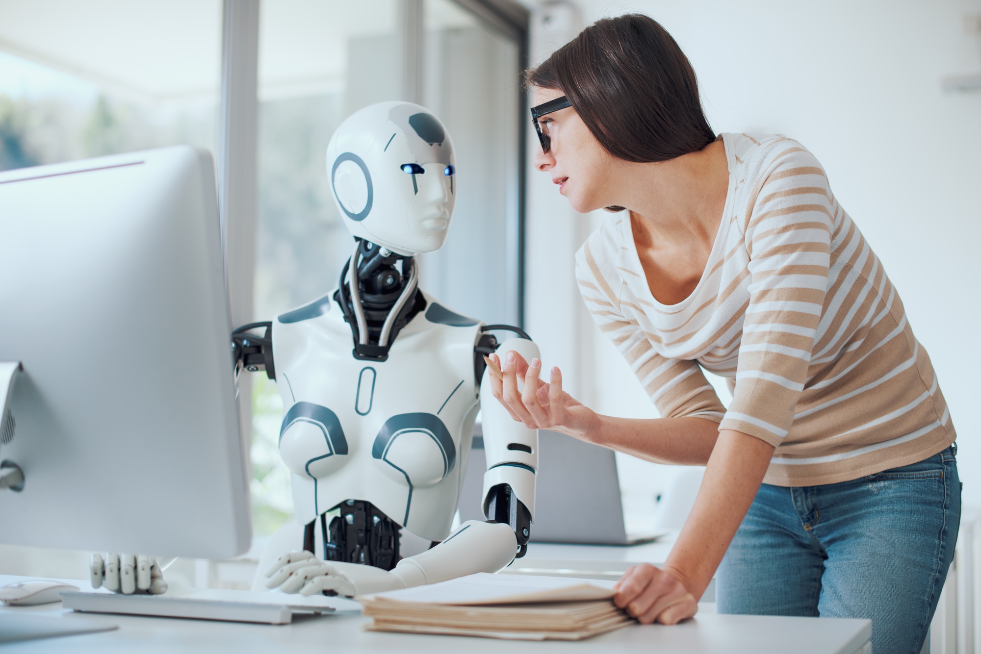 Woman and AI robot working together