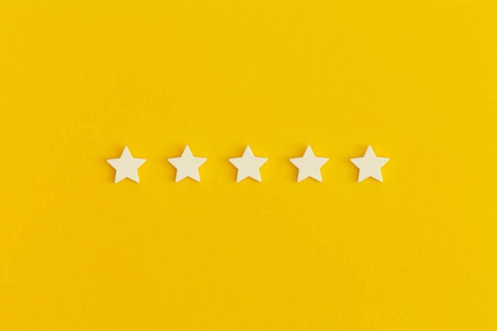 Five 5 stars, best excellent services rating on yellow background.