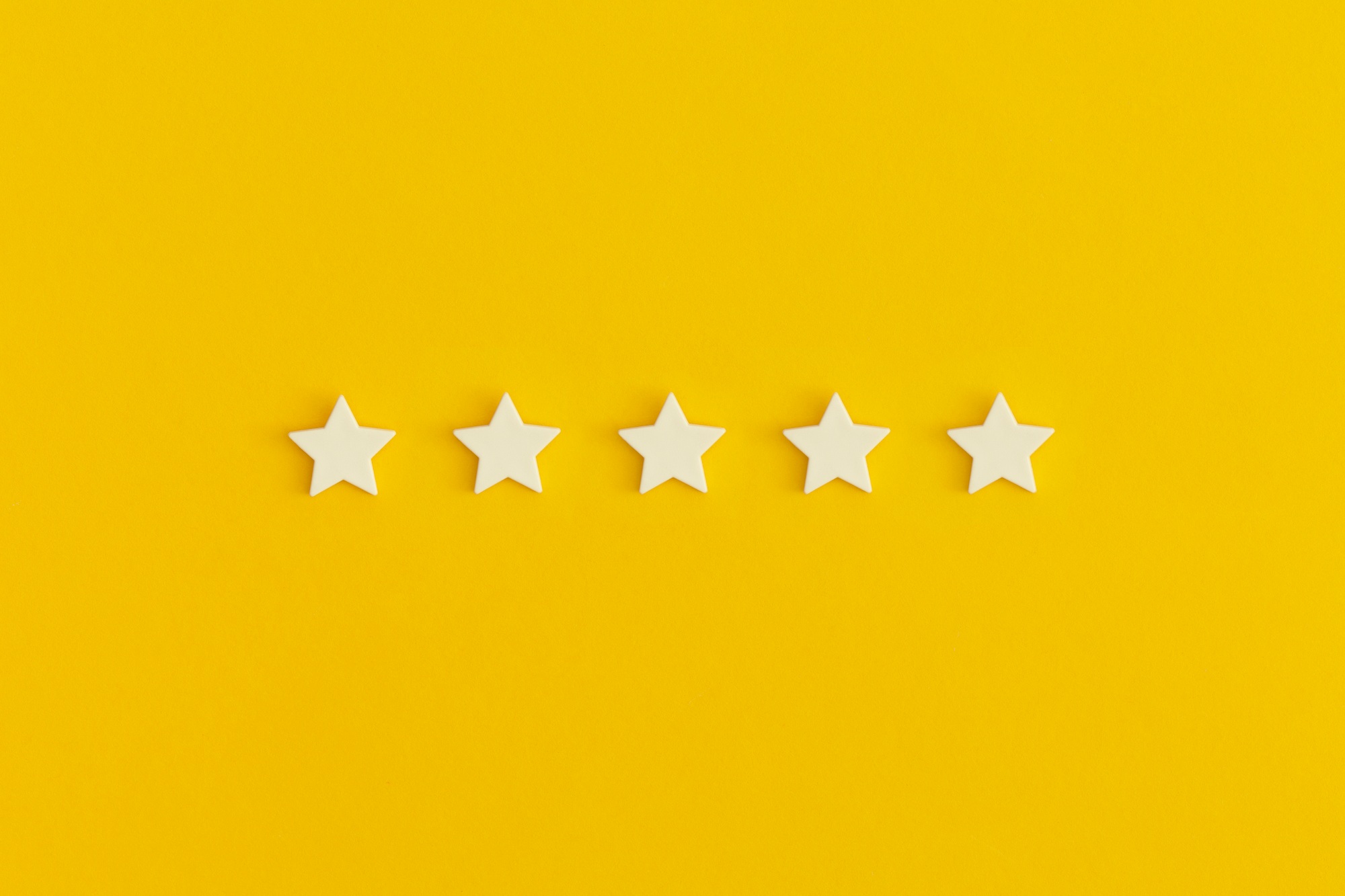 Five 5 stars, best excellent services rating on yellow background.